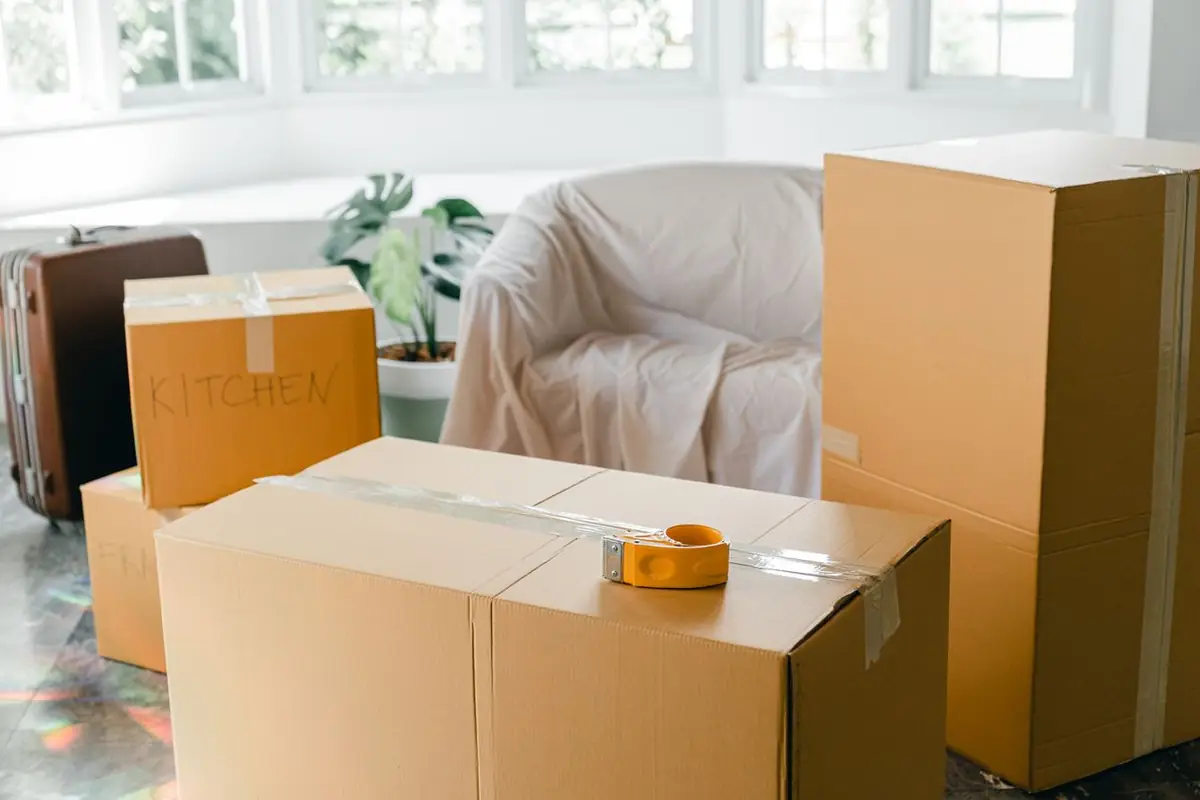Boxes and household belongings packed for removal and off-site cleaning after a fire