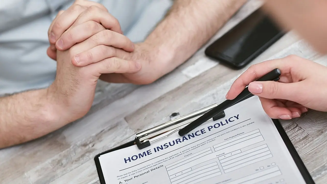 Reviewing an insurance policy document after smoke damage to a home